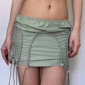 Nylon miniskirt with draw strong ties